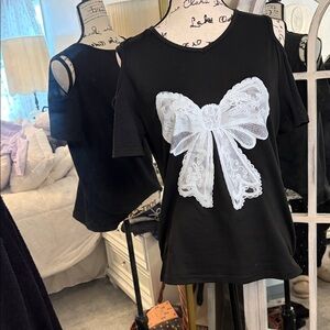Elegant Black Top with White Lace Bow